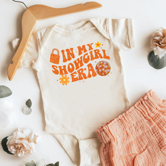 The Life Of A Showgirl Baby Bodysuit ,Funny New Born New Parent Baby Onesie®, New Mom Gift, Baby Shower Gift , Short Sleeve Tee Bella